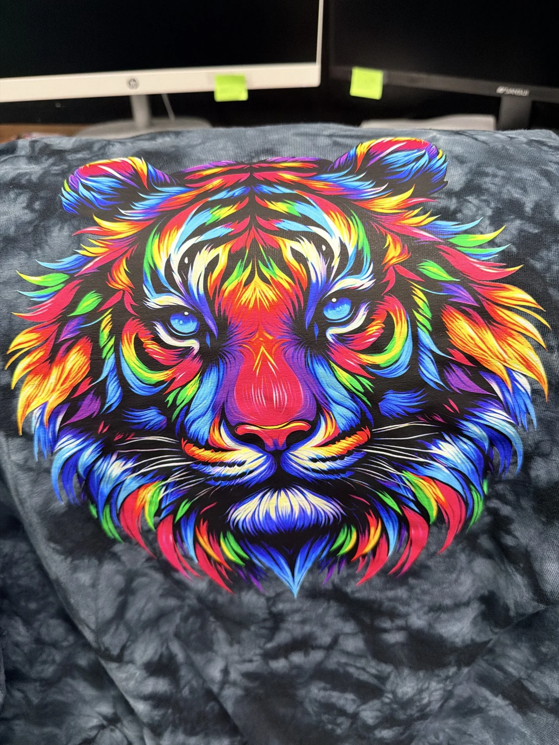 Colorful tiger artwork printed on dark apparel